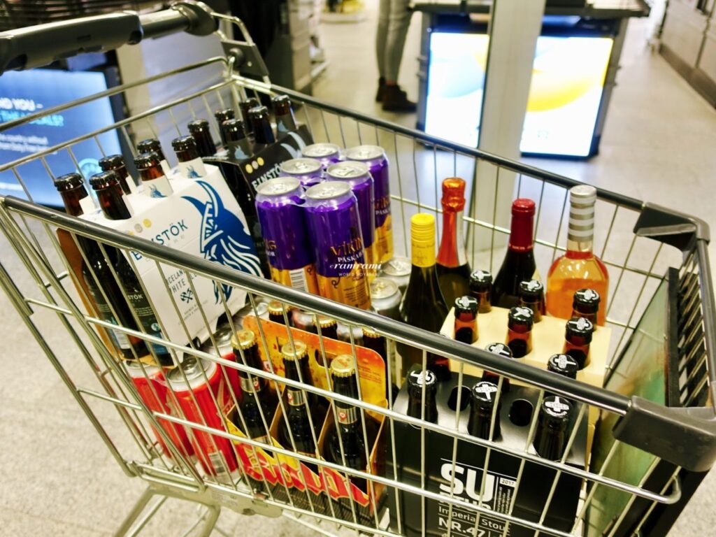 Travelers leaving Keflavik Airport with duty-free alcohol purchases