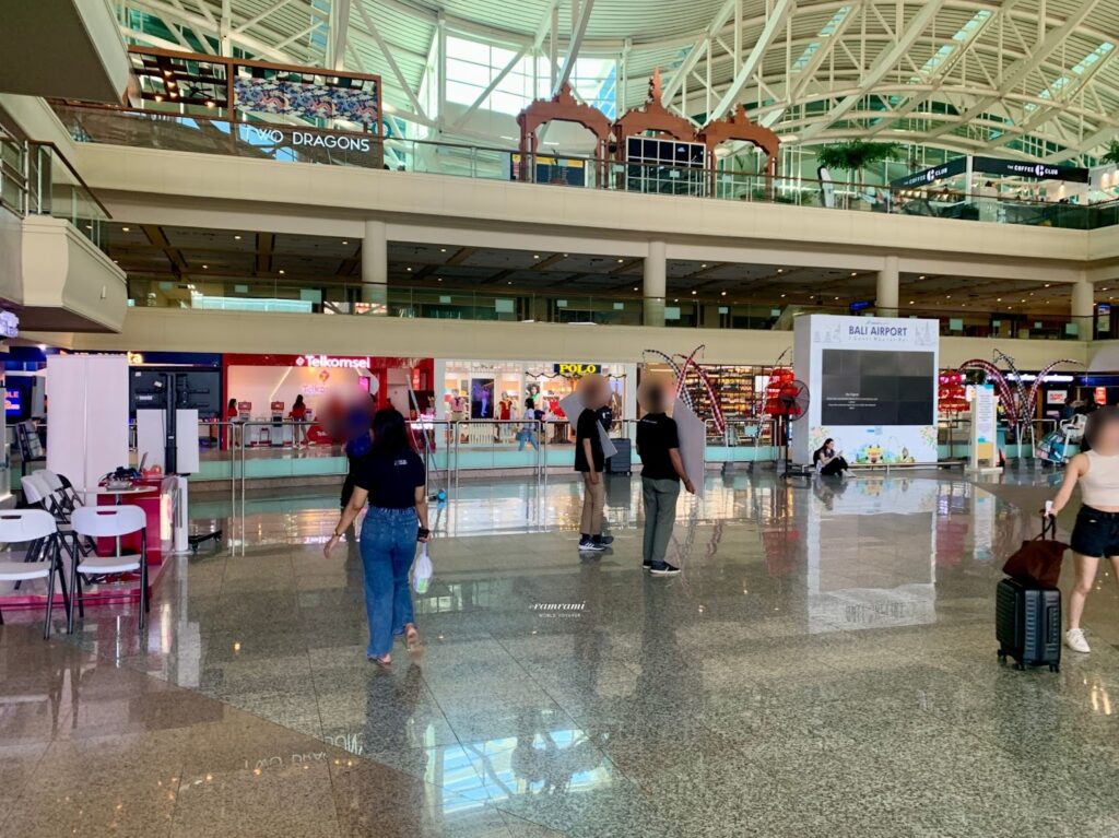 Bali airport taxi 2026 arrival hall and international terminal signage
