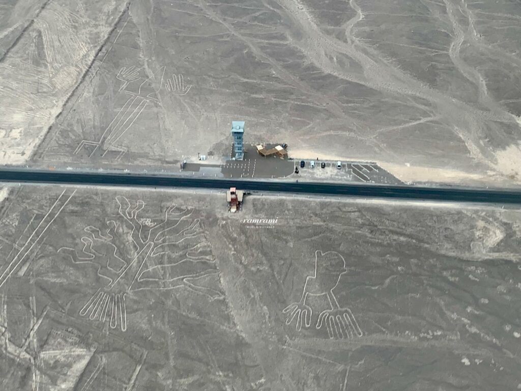 Nazca Lines flight aerial view of Tree and Hands geoglyph near Panamericana road