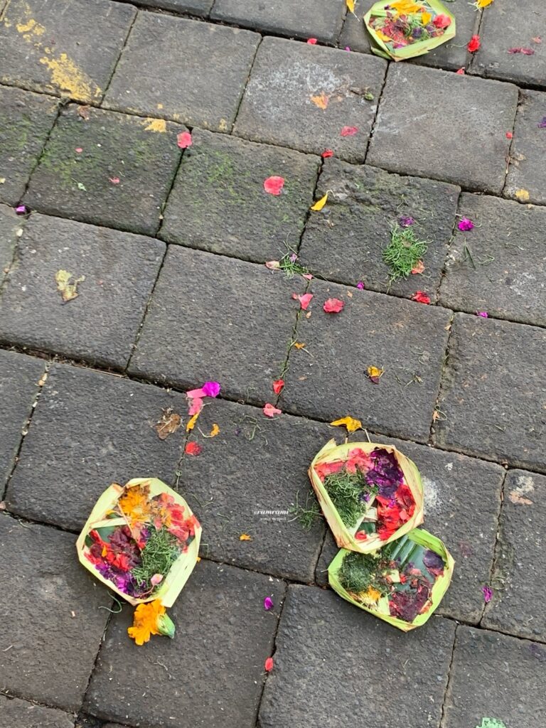 Canang Sari offerings placed on a Bali sidewalk